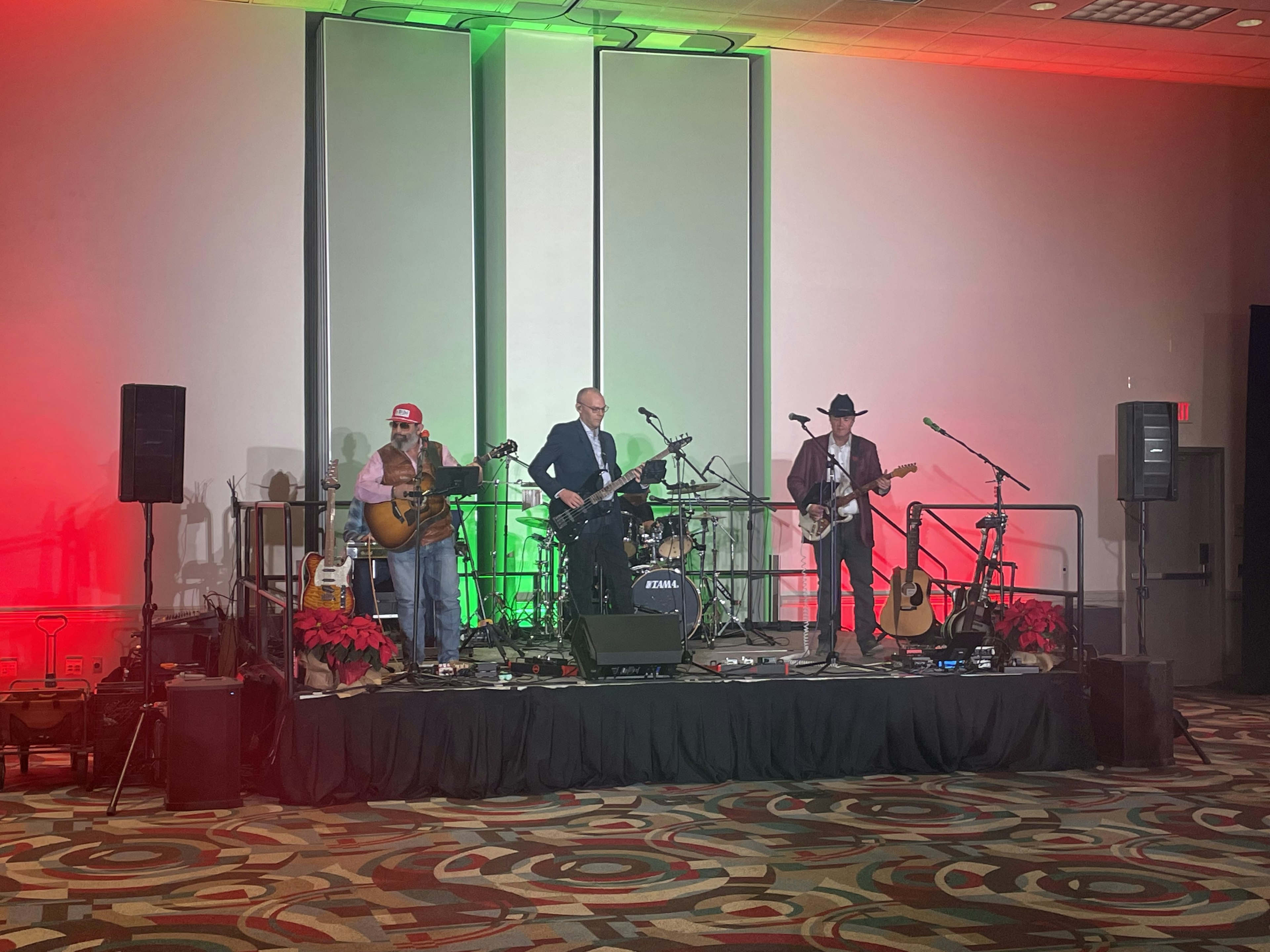 Texas Sunset Band performing on stage at an indoor event